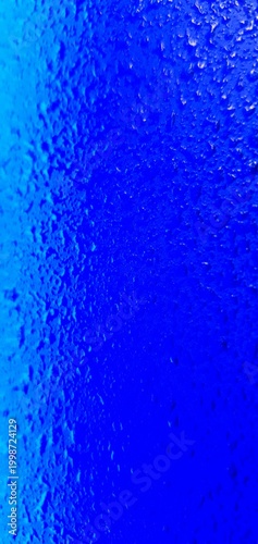 Abstract blue water texture with bubbles and droplets, gradient liquid background, macro underwater surface ideal for design, technology, and creative projects