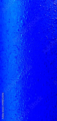 Abstract blue water texture with bubbles and droplets, gradient liquid background, macro underwater surface ideal for design, technology, and creative projects