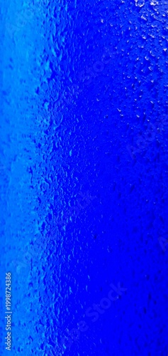 Abstract blue water texture with bubbles and droplets, gradient liquid background, macro underwater surface ideal for design, technology, and creative projects