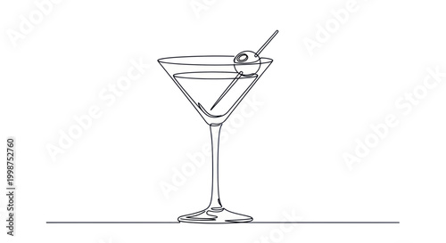 Cocktail martini glass with green olive.