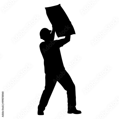 Silhouette of a construction worker carrying a large bag.