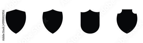 Four black shield shapes on isolated white background for protection and security concepts