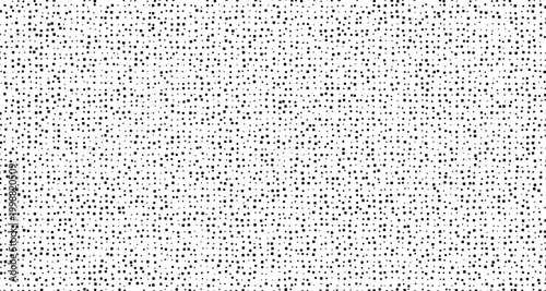 Black dots scattered on white background pattern