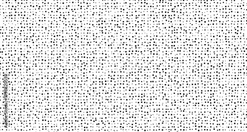 Black dots scattered on white background pattern