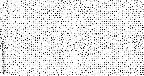 Black dots scattered on white background texture