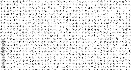 Black dots scattered on white background texture