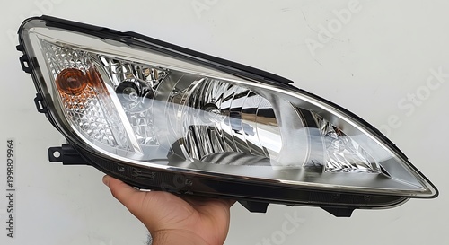 Front Headlight Assembly for a Modern Car Held by Hand