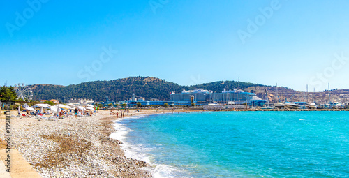 Bar Montenegro Beach tourists people water waves sun loungers parasols.