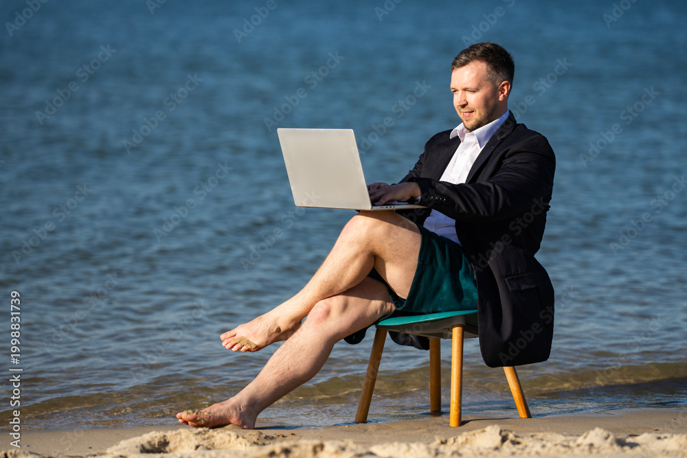 Naklejka premium Vacation work with laptop outdoors. Businessman turns vacation into workation. Vacation lifestyle meets remote business. Beach chair supports vacation work.