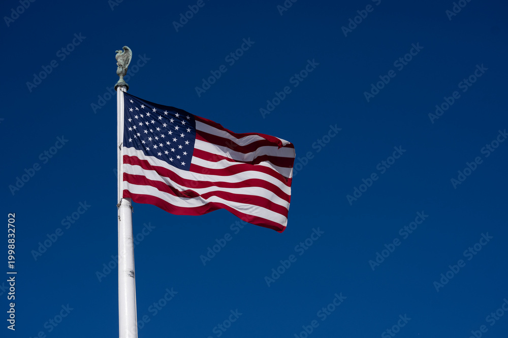 Fototapeta premium Flag American waving USA sky. American patriotic freedom liberty flag. USA democracy culture symbol flag. American independence heritage flag.