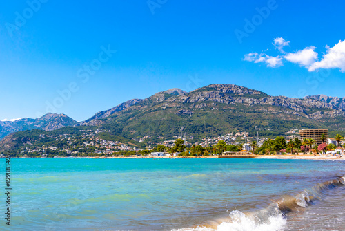 Sunny Beach in Bar Montenegro Sand Clear Blue Water Mountains.