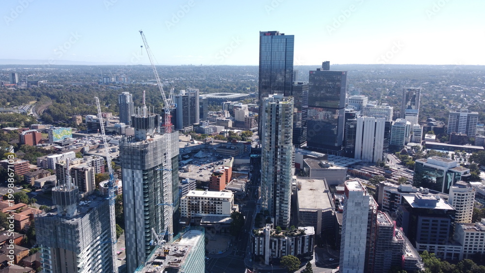 Fototapeta premium New apartment and office towers under construction driving growth & development 