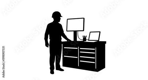 Silhouette of an engineer or worker at a computer workstation