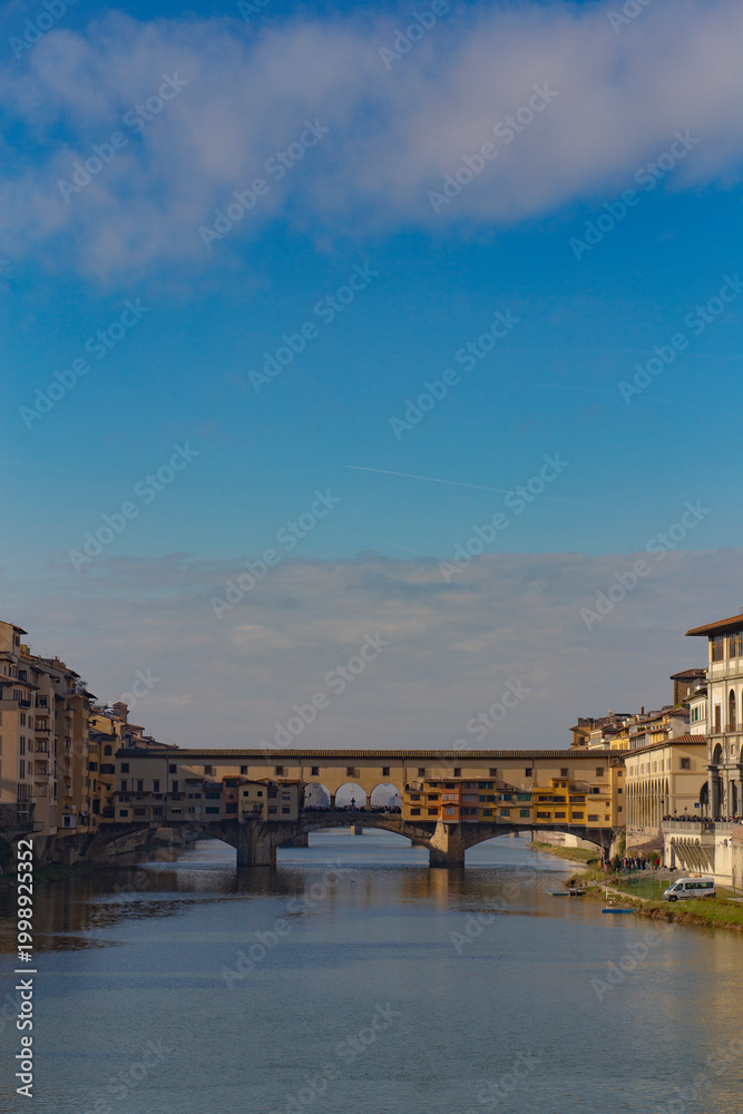 Fototapeta premium Famous beautiful Ponte Vecchio bridge landmark on the Arno river in the majestic city of Florence, Italy