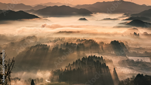 Sea of clouds at sunrise over mountains in Japan