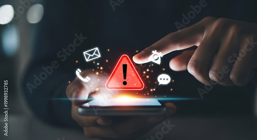 Person using smartphone with glowing digital alert icons and warning symbol floating