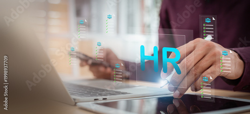 HR Human Resources management concept with businessman using tablet and laptop for recruitment and candidate selection.