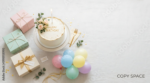 Birthday celebration setup with a cake and wrapped gifts and bal