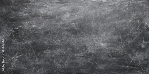 Scratched and distressed dark gray wall metallic surface with scratches and marks for backgrounds or textures