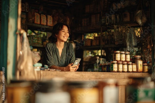 Smiling Thai Female Shopkeeper in Local Grocery Store in Thailand