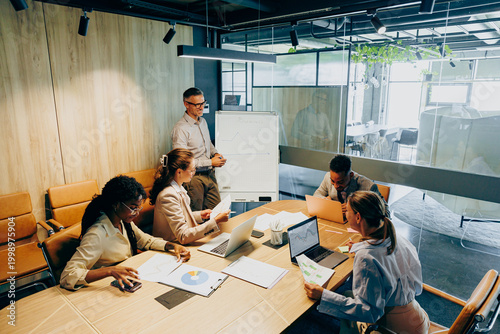 Photography Modern office setting focused on effective project task distribution