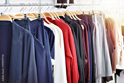 Clothing rack with colorful garments in retail store