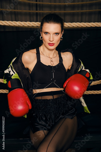 Boxing session for a female athlete in a gym setting with focus on confidence and strength