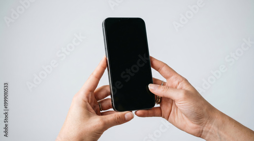 Hands holding smartphone blank screen close up isolated background technology device mobile phone human hand finger touch screen digital device