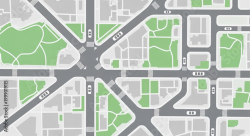 Aerial view of a city intersection with roads and green parks.