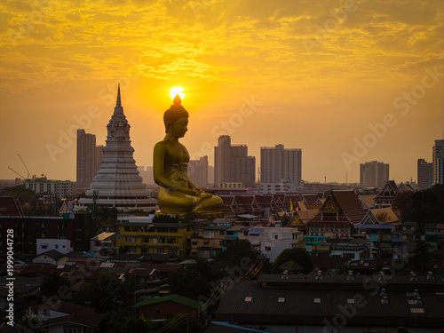 Aerial view Phra Buddha Dhammakaya Thep Mongkol Wat Paknam temple sunset light sky with modern office building