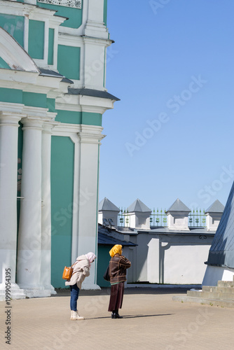 Smolensk, Russia — April 21, 2026: Two Orthodox Women Praying at Assumption Cathedral