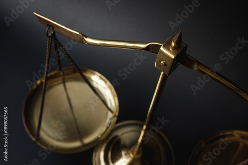 Elegant  golden scale justice scale in dramatic lighting representing balance, fairness, and legal judgment. Ideal for law, business ethics, and decision-making concepts. 