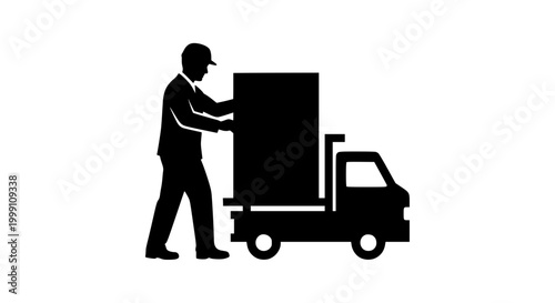 Silhouette of a delivery worker loading a large package onto a truck