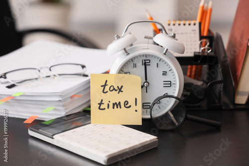 Alarm clock with text TAX T...
