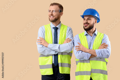 Male engineers on beige bac...