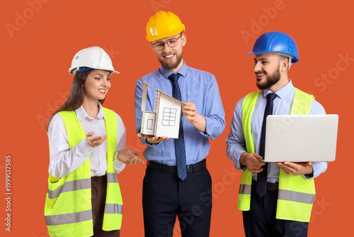 Group of engineers with hou...