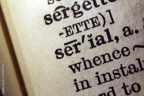 Bild auf Leinwand Word serial on dictionary page, macro close up