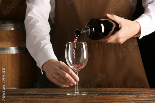 Female bartender pouring re...