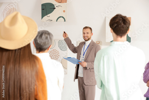 Male guide showing painting...