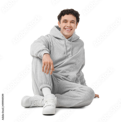 Young man in grey sports su...