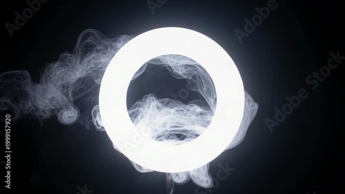 Cinematic white smoke ring portal effect on black background.