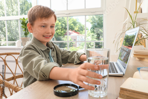 Cute little boy with laptop...