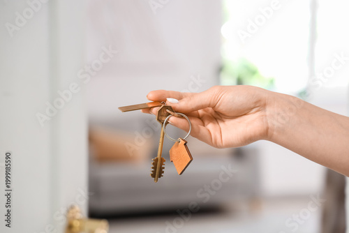 Female hand with key from f...