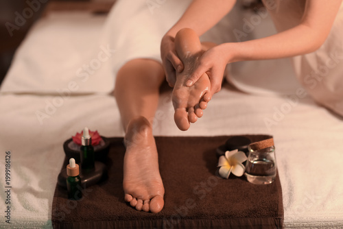 Woman getting foot massage ...