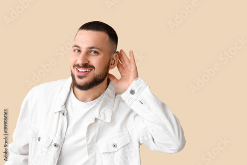 Young man with hearing aid ...