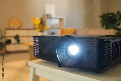 Canvastavla Modern video projector on coffee table in stylish living room, closeup
