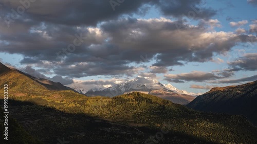 Clouds Covering Snowy Peaks of Caucasus Mountains Above Autumn Landscape, Time lapse