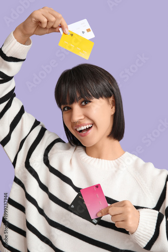 Happy young woman with many...