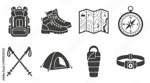 Collection of hiking gear including a backpack, boots, map, compass, trekking poles, tent, sleeping bag, and headlamp