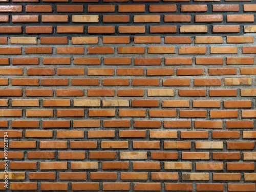 detailed frontal view of a rustic, weathered red brick wall. clear seamless texture pattern of traditional clay bricks and mortar, perfect for background design and architecture concepts.